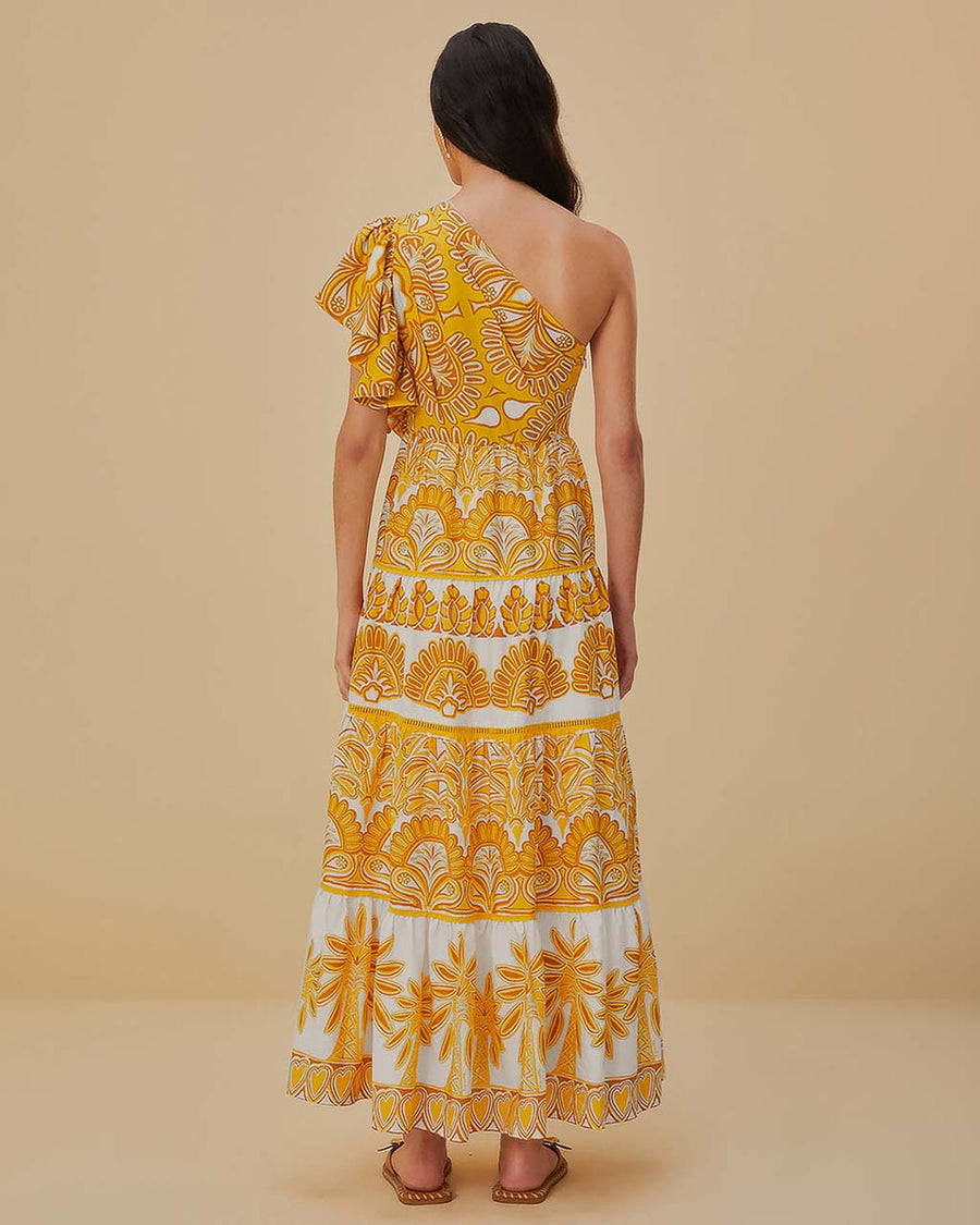 back view of model wearing yellow and white abstract print one shoulder maxi dress