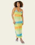 model wearing green, blue and orange ombre stripe maxi dress with thin straps