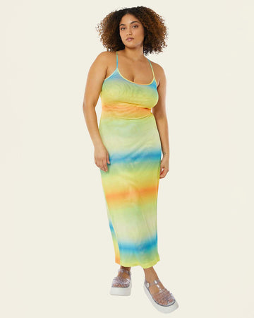 model wearing green, blue and orange ombre stripe maxi dress with thin straps