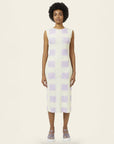 model wearing a white tank midi dress with light violet squares print