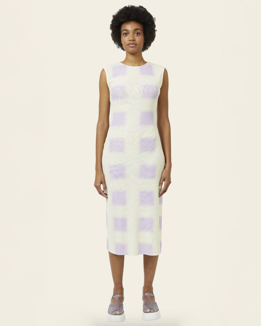 model wearing a white tank midi dress with light violet squares print