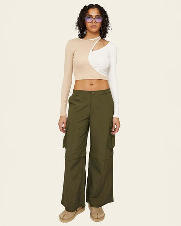 model wearing olive green wide leg pants with side cargo pockets