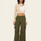 model wearing olive green wide leg pants with side cargo pockets