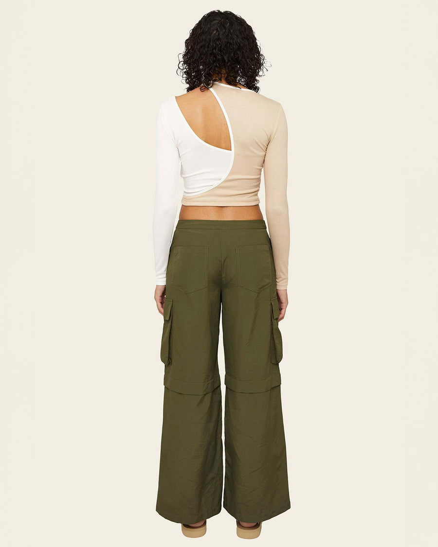 back view of model wearing olive green wide leg pants with side cargo pockets