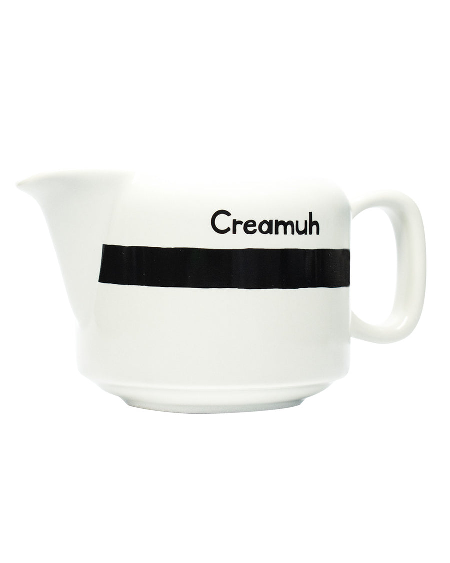 side view of white and black 'Creamuh' dish