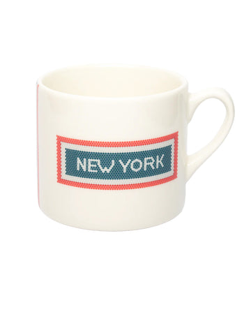 cream coffee mug with red and blue subway tile 'NEW YORK' across the front