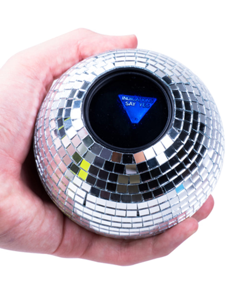 model holding disco ball decision ball