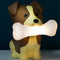 brown and tan dog with a bone in their mouth mood light