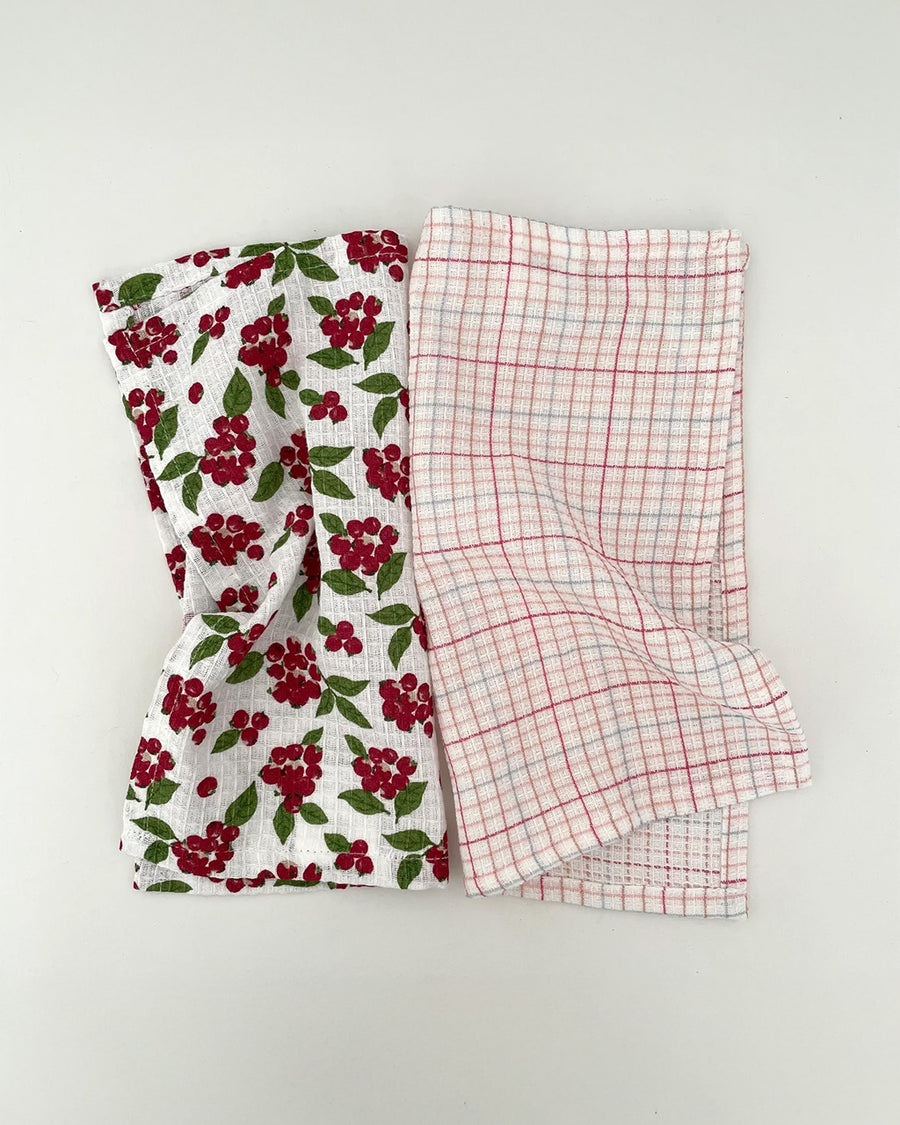 set of two woven dishcloths: white with cranberry and white with plaid in red, pink and blue