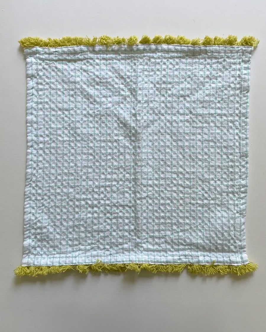 plaid dishcloth with mint with yellow fringe