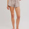 model wearing cream and brown plaid crinkle boxer shorts