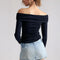 back view of model wearing light denim skort with the shorts peeking out of the bottom