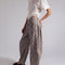 side view of model wearing muted brown leopard barrel print jeans