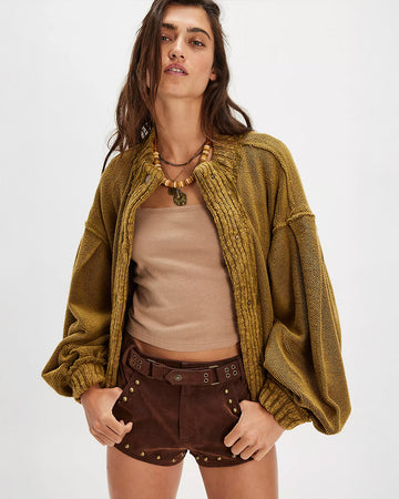 model wearing slouchy olive green textured open front cardigan