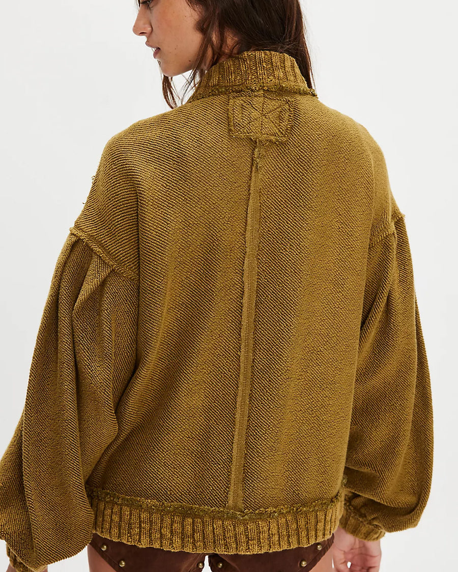 back view of model wearing slouchy olive green textured open front cardigan