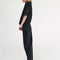 side view of model wearing washed black barrel jeans