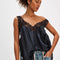 model wearing black silky tank with black lace trim on the bust, straps and hem