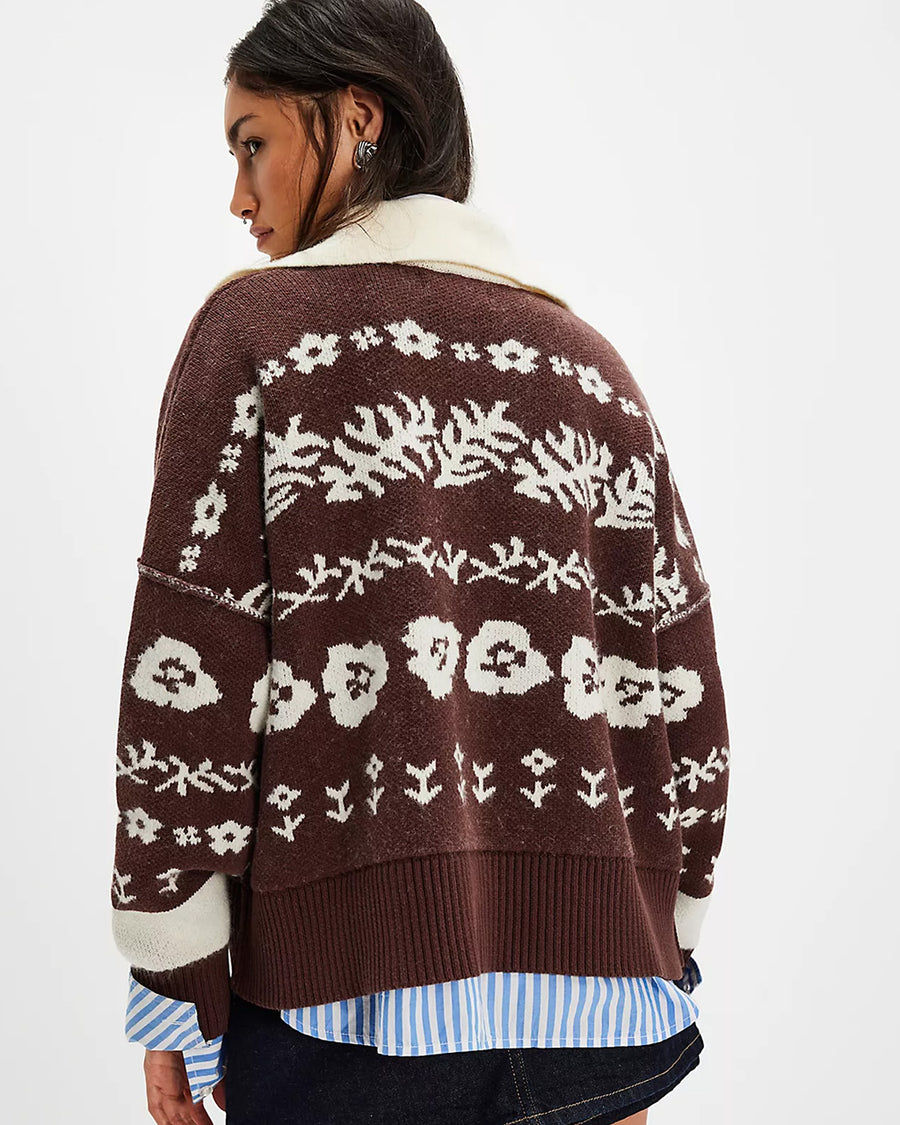 back view of brown and cream floral cardigan with cream trim