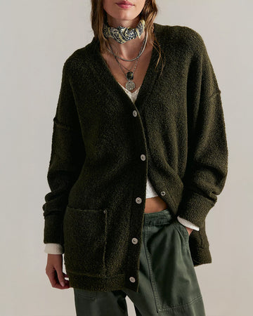 model wearing oversized green textured cardigan