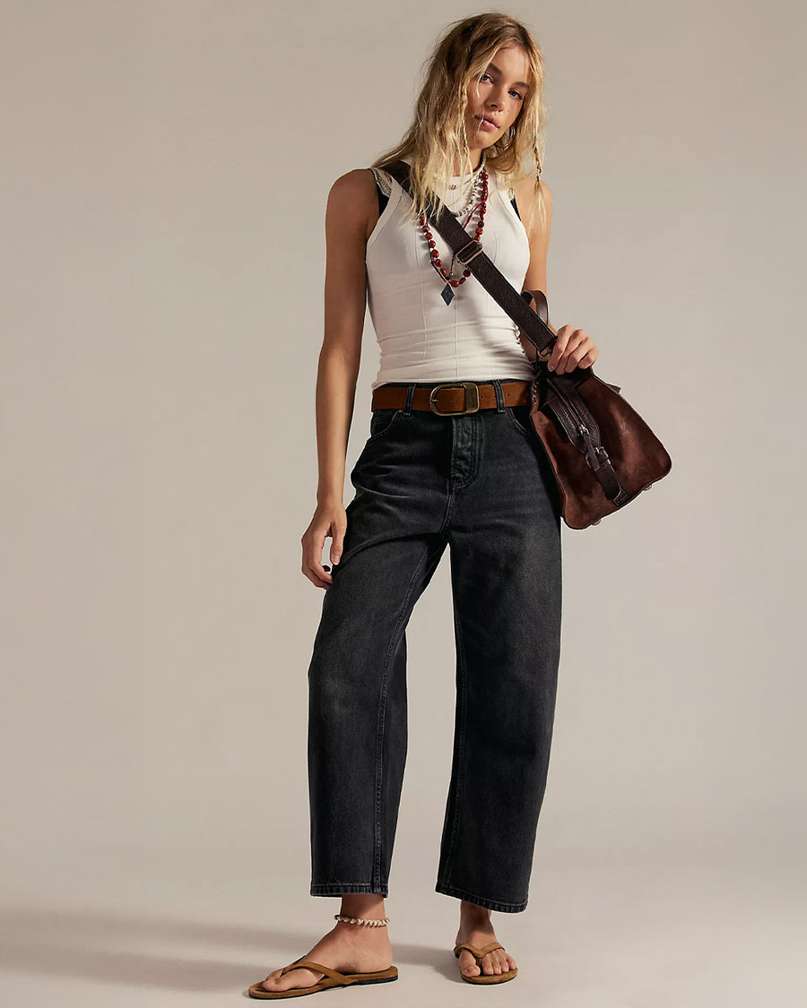 model wearing washed black relaxed fit low rise denim