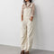model wearing off-white barrel leg overalls