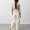 back view of model wearing off-white barrel leg overalls