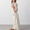 side view of model wearing off-white barrel leg overalls