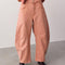 model wearing dessert pink barrel pants