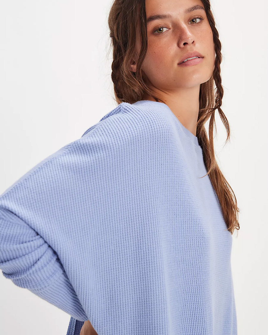 side view of model wearing periwinkle oversized thermal top