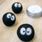set of three black mini sprites with big white eyes