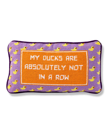 purple throw pillow with duck border and 'my ducks are absolutely not in a row' across the front