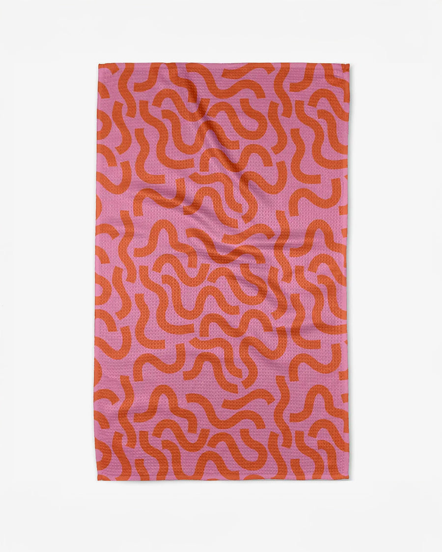pink tea towel with orange squiggle print