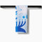 blue and white Hanukkah tea towel on a towel rack