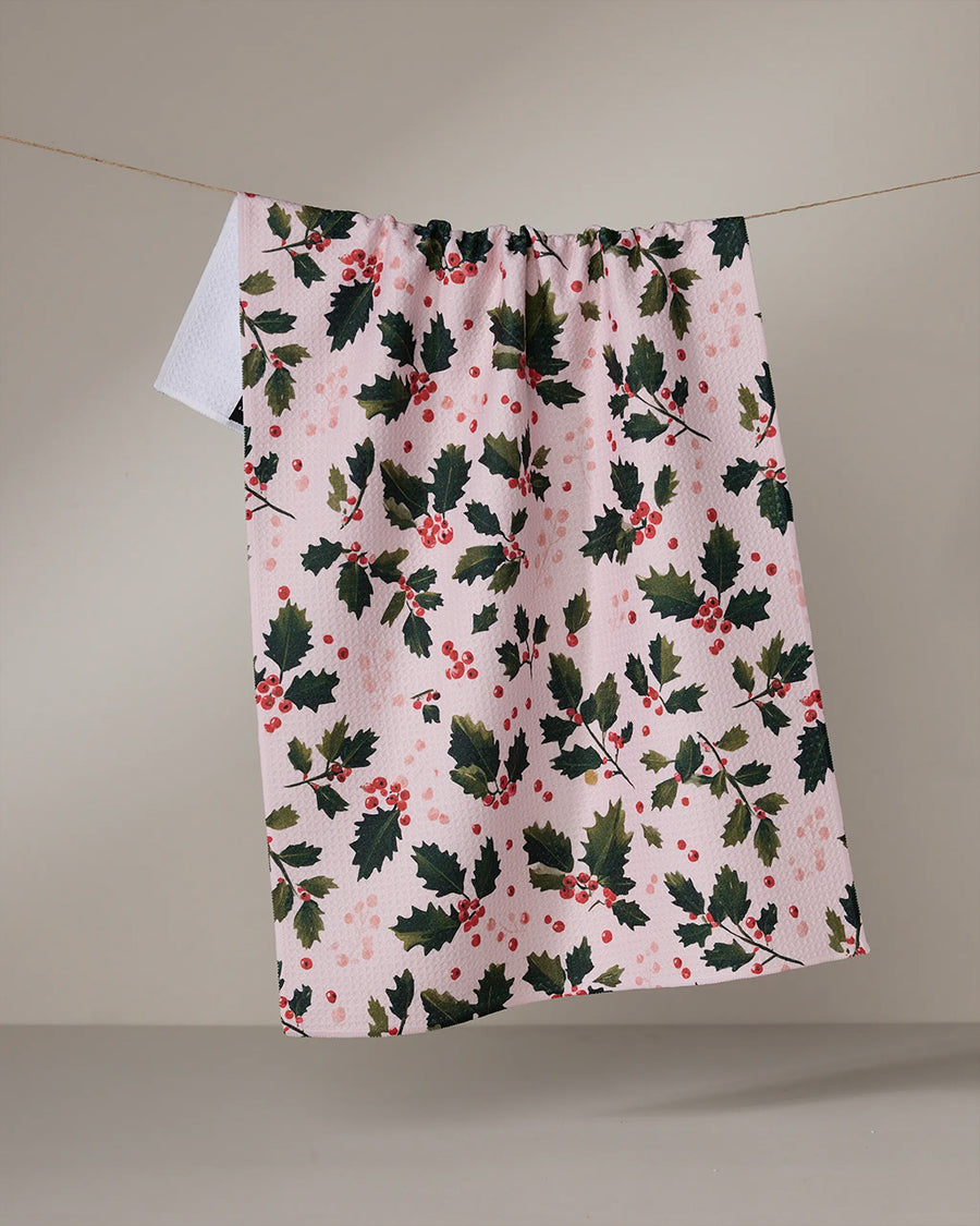 pink tea towel with holly print