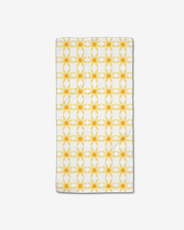 white bar towel with yellow repeating daisies print