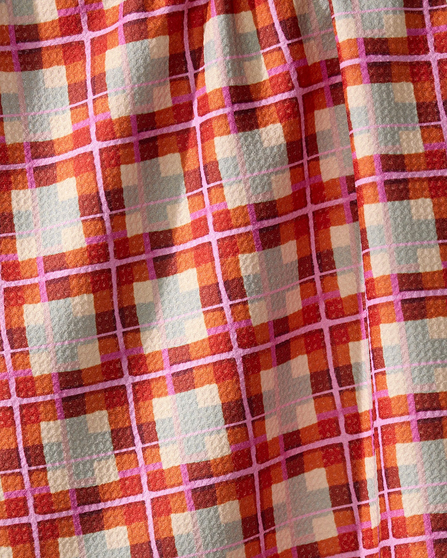 up close of red light blue, cream and pink autumn plaid kitchen towel