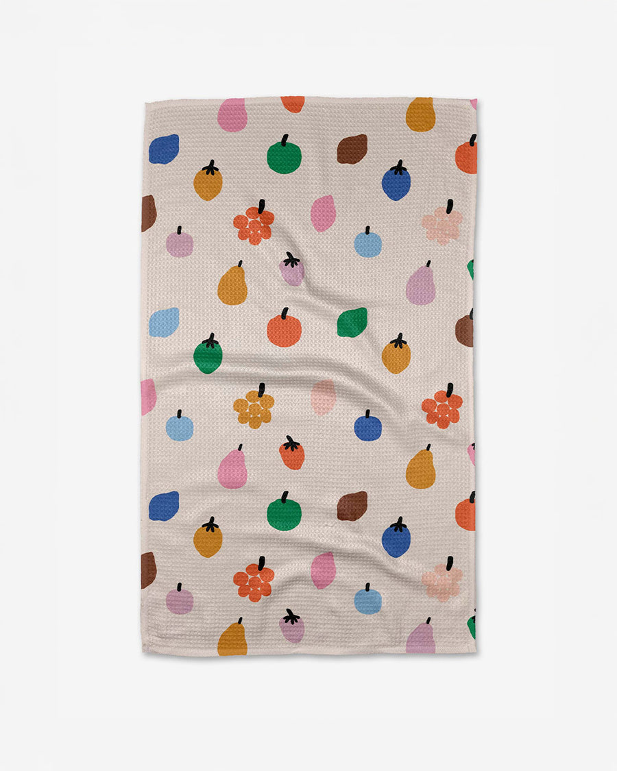 tan teal towel with colorful fruit print