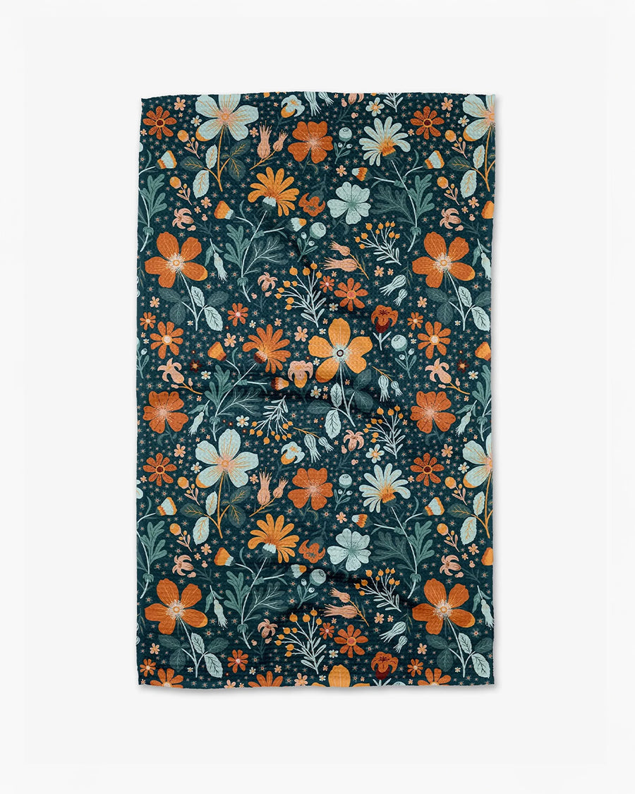 dark teal tea towel with colorful floral print
