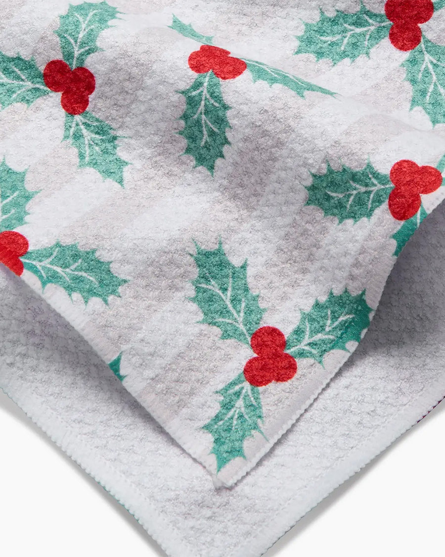 up close of white and tan vertical stripe with mistletoe print