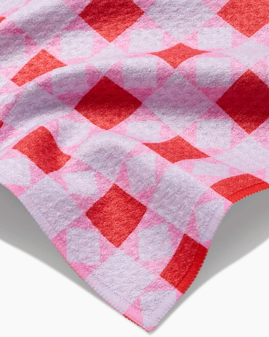 up close of pink and red quilt bar towel
