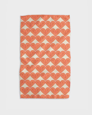 cream tea towel with orange retro heart print