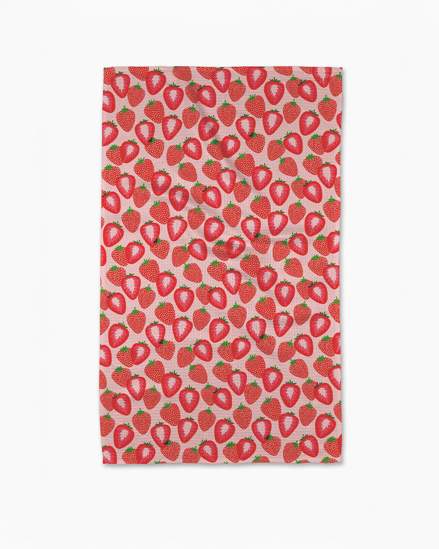 pink tea towel with all over clustered strawberry print