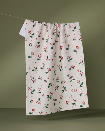 white tea towel with dainty holly sprig print