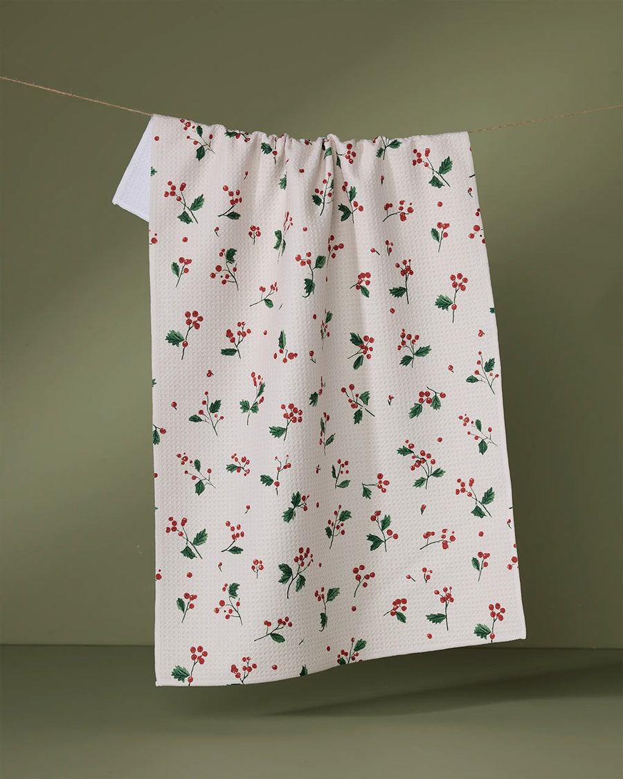 white tea towel with dainty holly sprig print