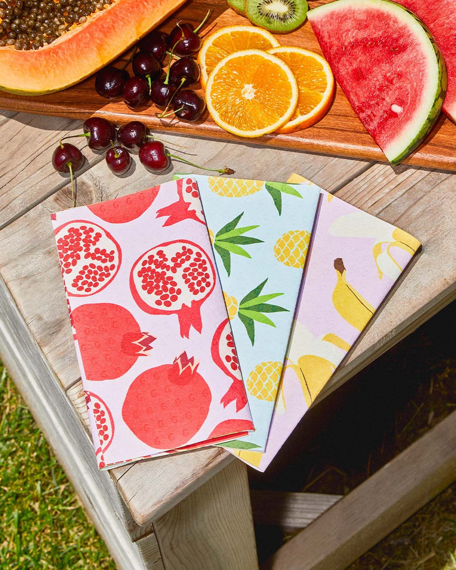 fruit print not paper towels on table with a tray of fruit