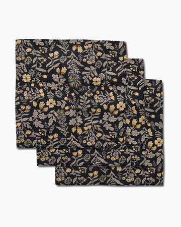 set of three dishcloths: black with golden yellow woodland wildflowers
