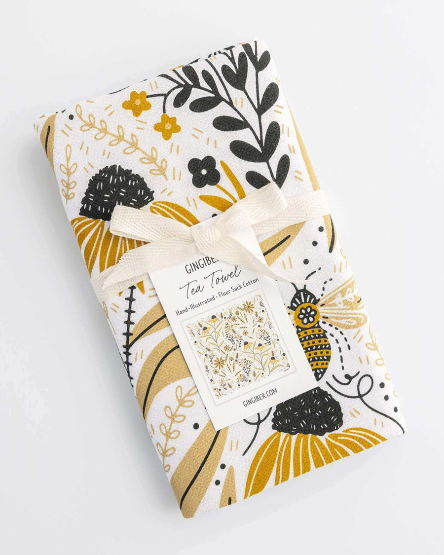 packaged white tea towel with goldenrod floral and bee print