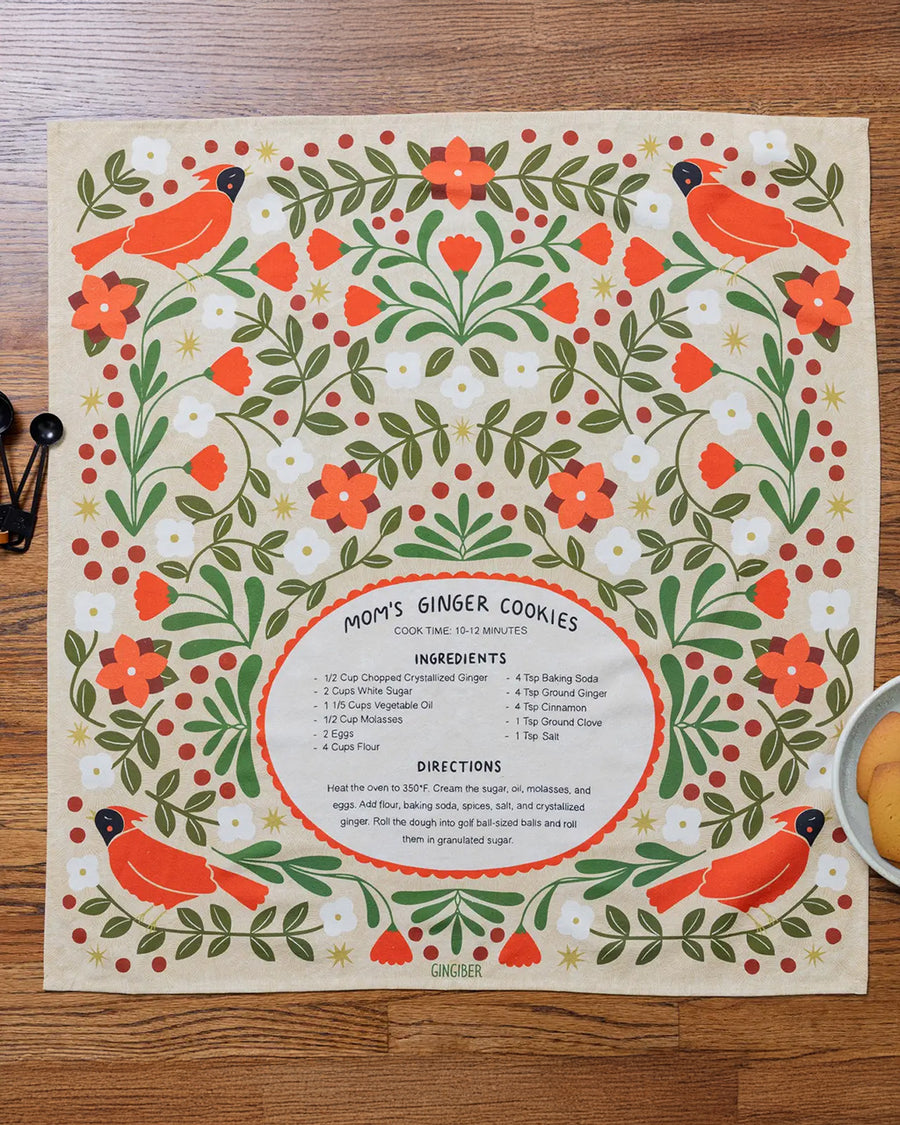 cream tea towel with mom's ginger cookies recipe and surrounded by cardinals and floral print