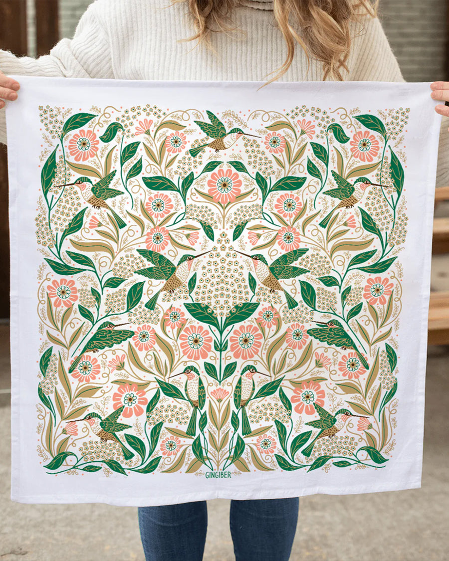 model holding hummingbird and floral abstract tea towel