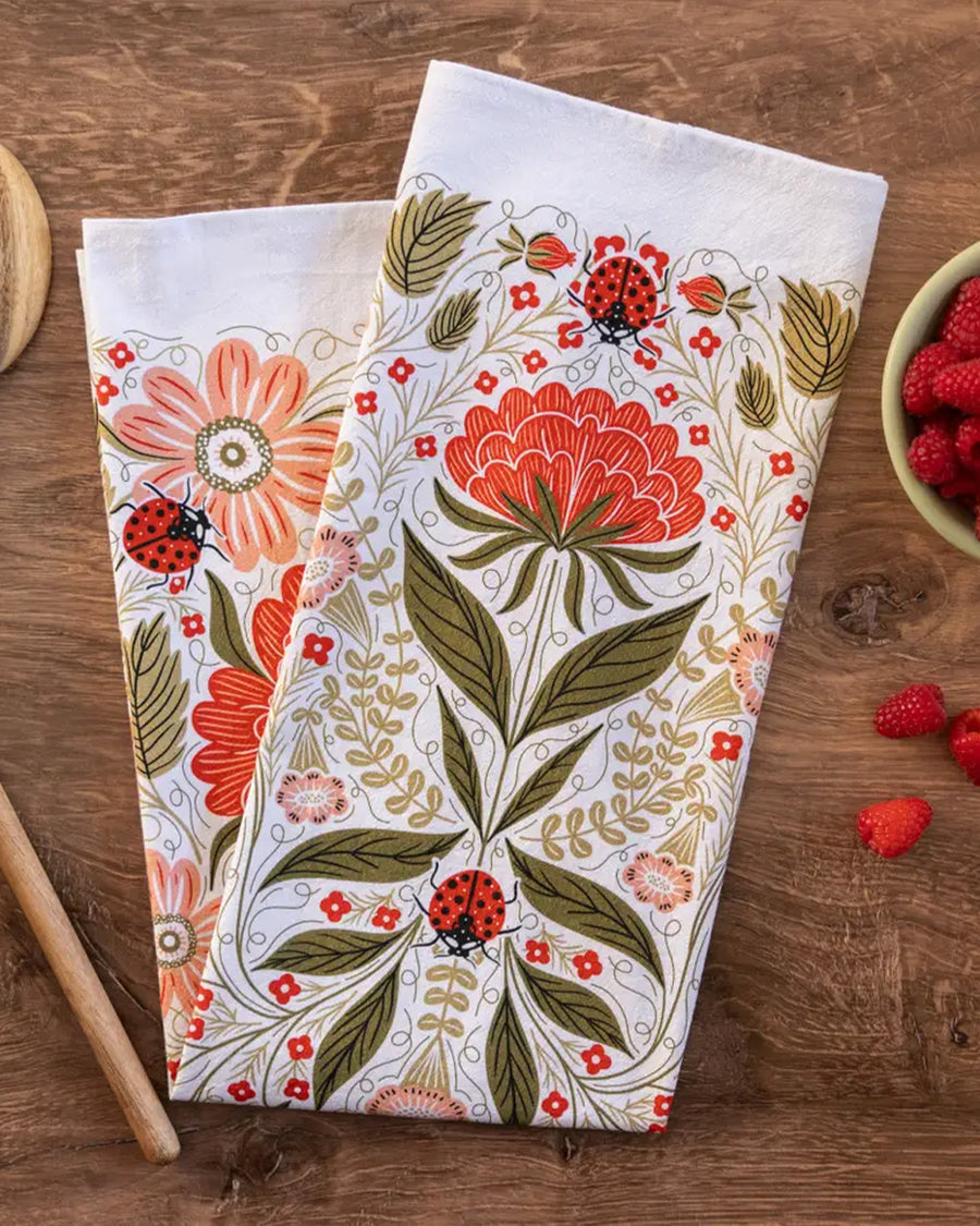 folded ladybug and red floral abstract tea towel